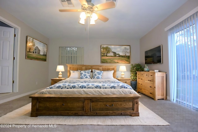 bedroom featuring ceiling fan and light carpet