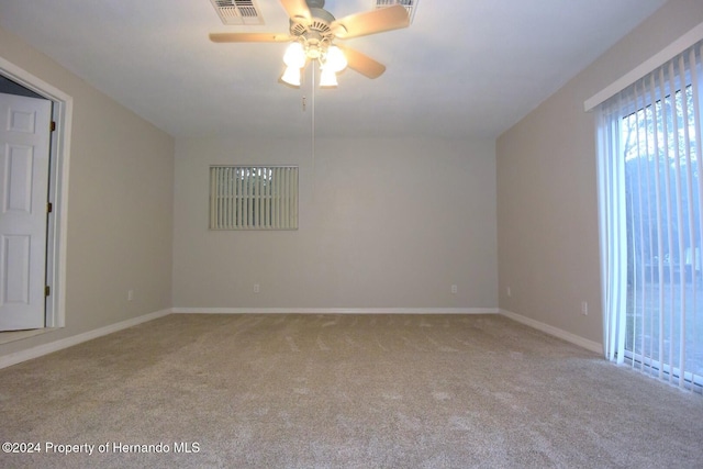 unfurnished room with carpet flooring and ceiling fan