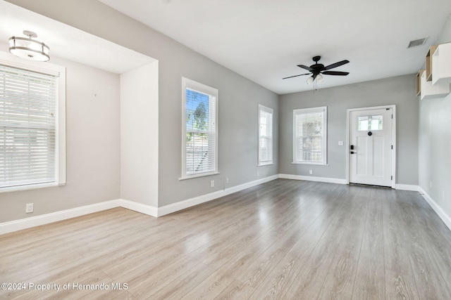 interior space featuring light wood-type flooring and ceiling fan