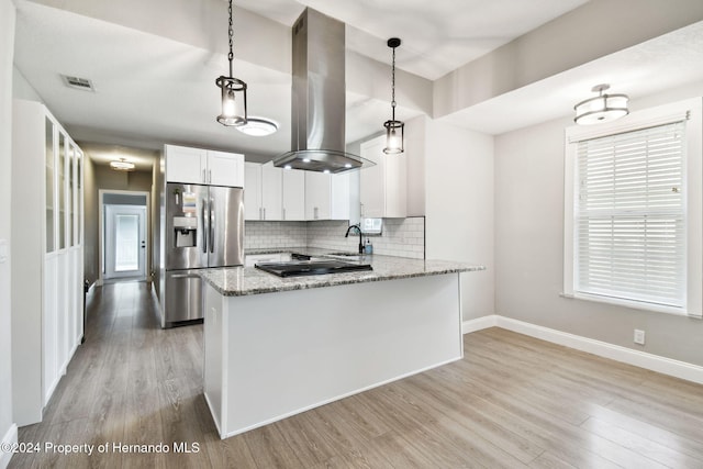 kitchen with island exhaust hood, light stone countertops, white cabinets, stainless steel fridge with ice dispenser, and hanging light fixtures