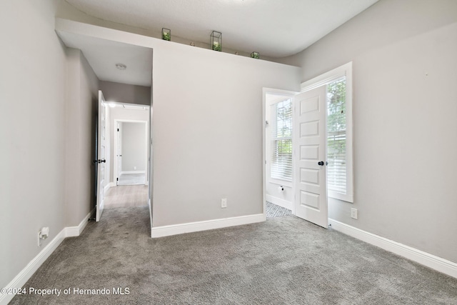 unfurnished bedroom with carpet floors