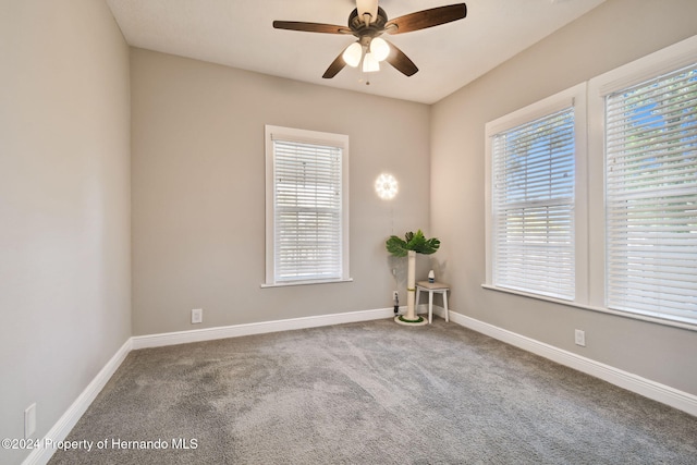 unfurnished room featuring carpet floors and ceiling fan