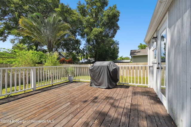 wooden deck featuring grilling area