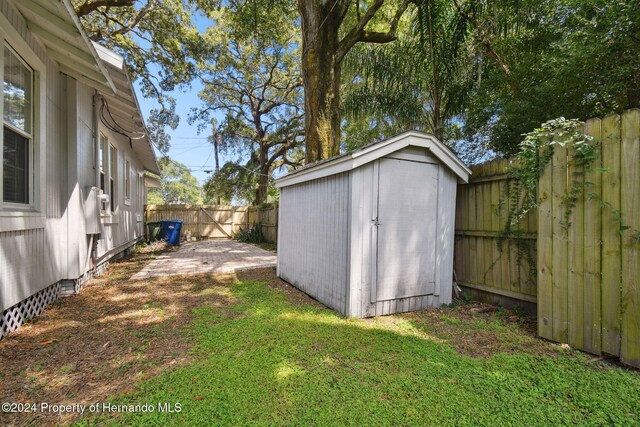 view of outbuilding featuring a yard