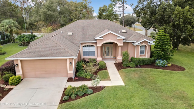 view of front facade featuring a garage and a front lawn