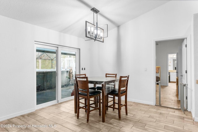 dining room featuring an inviting chandelier and light wood-type flooring