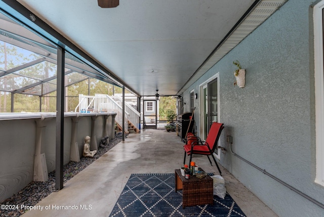 view of patio with a lanai and ceiling fan