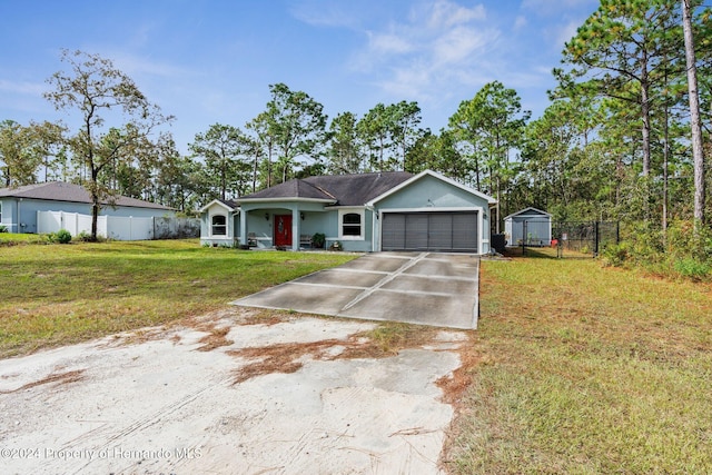 ranch-style home featuring a garage and a front lawn