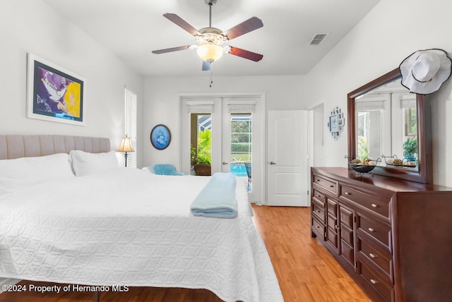 bedroom with ceiling fan, light wood-type flooring, and access to outside