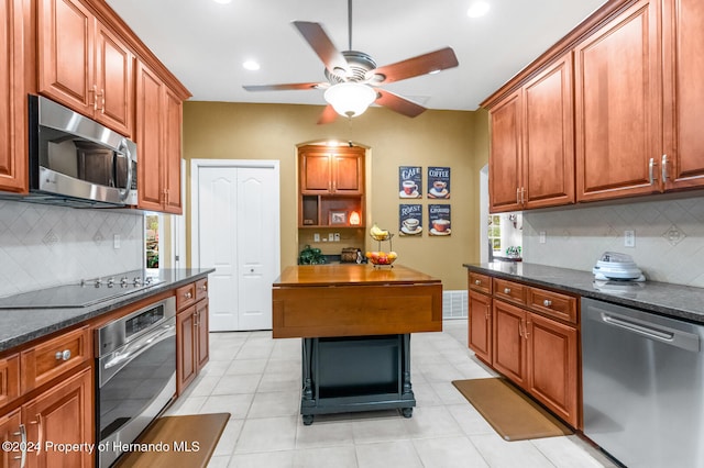 kitchen featuring backsplash, stainless steel appliances, and a wealth of natural light