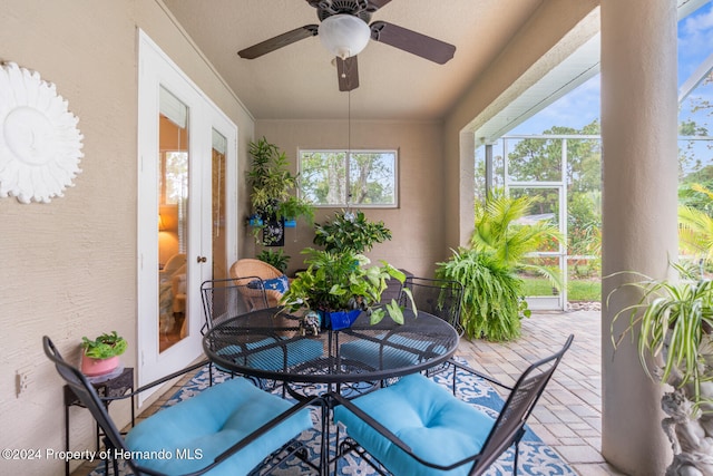 sunroom / solarium with ceiling fan