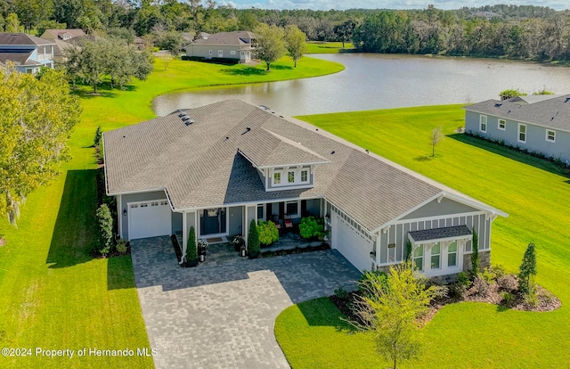 birds eye view of property featuring a water view