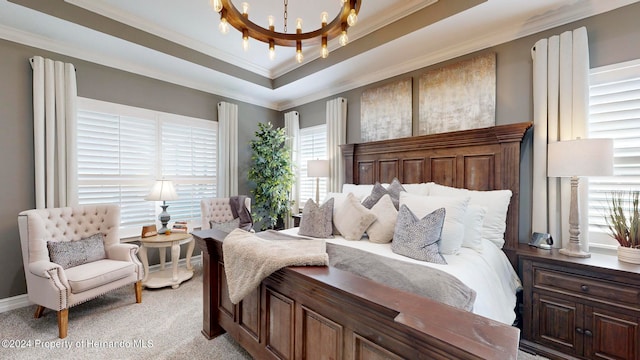 bedroom featuring a tray ceiling, a chandelier, light colored carpet, and ornamental molding