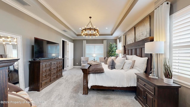 carpeted bedroom featuring a notable chandelier, a raised ceiling, and ornamental molding