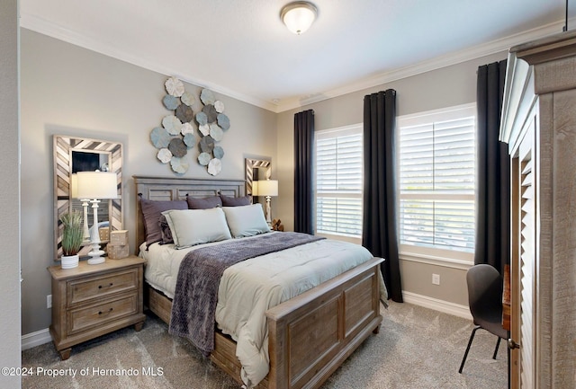 carpeted bedroom featuring ornamental molding