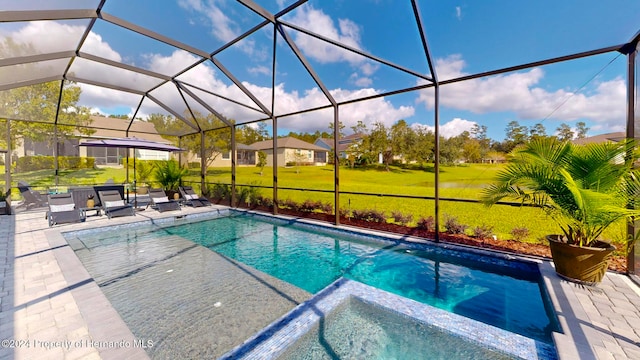 view of swimming pool with a patio, a yard, and a lanai