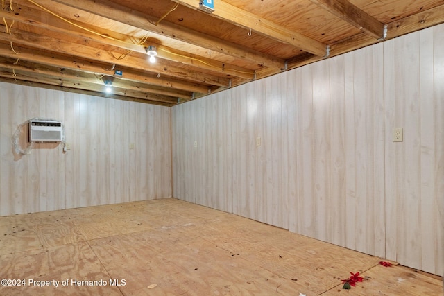 basement featuring an AC wall unit