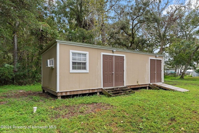 view of outdoor structure with a yard