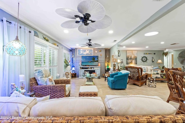 tiled living room featuring ceiling fan