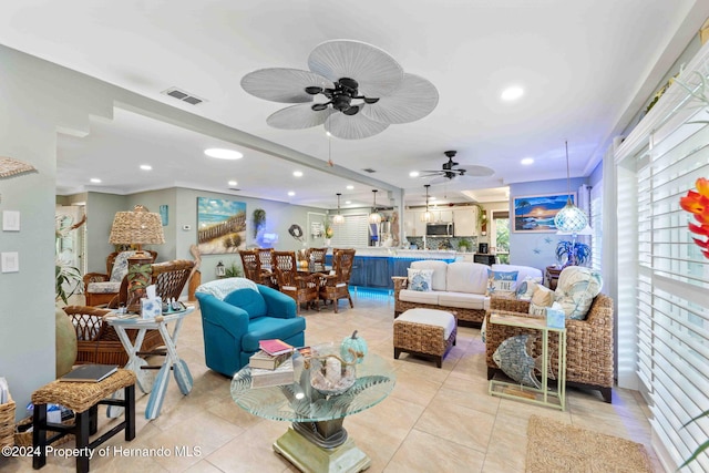 living room with light tile patterned flooring and ceiling fan