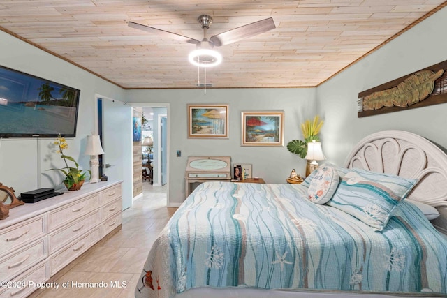 bedroom with ornamental molding, ceiling fan, wood ceiling, and light tile patterned floors