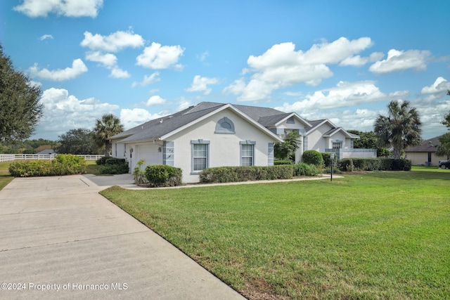 ranch-style house with a front lawn