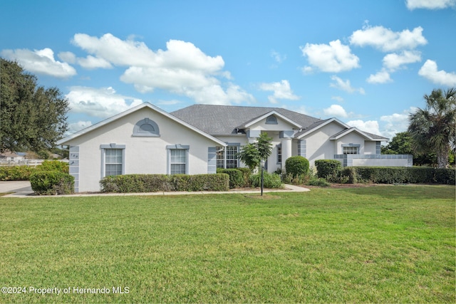 ranch-style house with a front yard