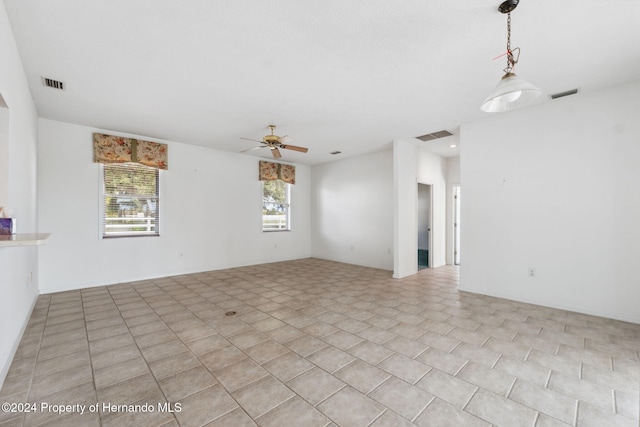 unfurnished room featuring ceiling fan