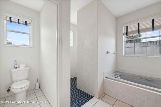 bathroom with tile patterned floors, plenty of natural light, toilet, and independent shower and bath