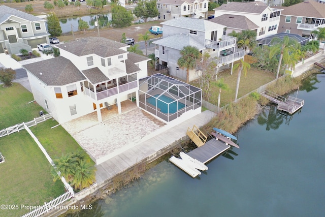 bird's eye view with a water view and a residential view