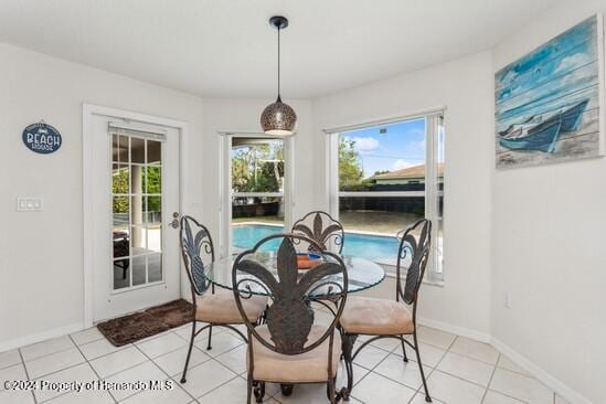 dining space featuring light tile patterned floors