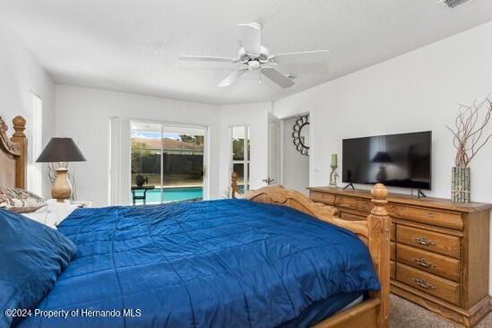 carpeted bedroom featuring ceiling fan and access to exterior