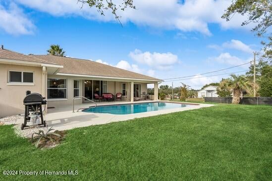 exterior space featuring a patio area and a yard