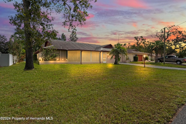 view of front of home featuring a lawn