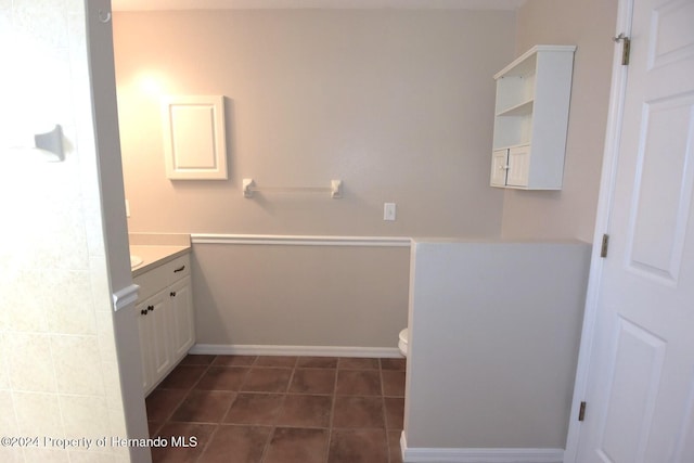 bathroom with tile patterned floors, vanity, and toilet