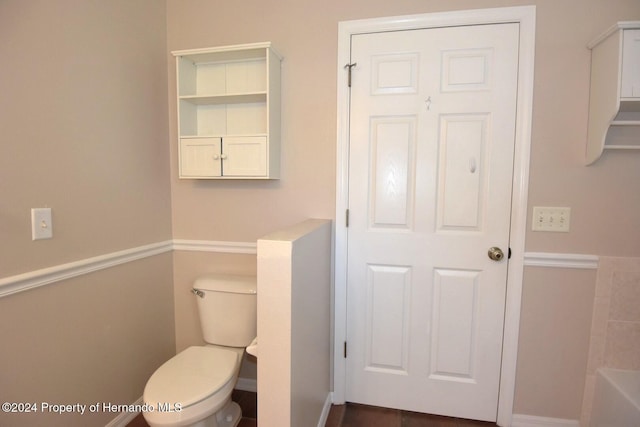 bathroom with a bathtub and toilet