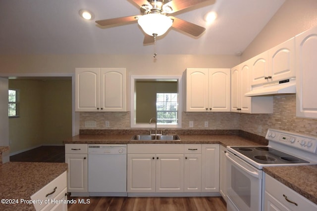 kitchen featuring lofted ceiling, white appliances, dark wood-type flooring, sink, and white cabinetry