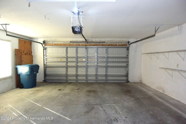 garage featuring a garage door opener