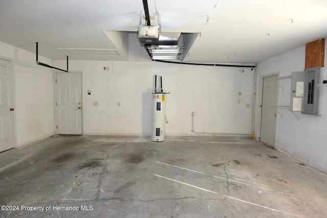 garage with electric water heater and electric panel