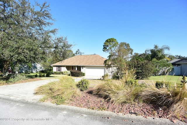 ranch-style house featuring a garage