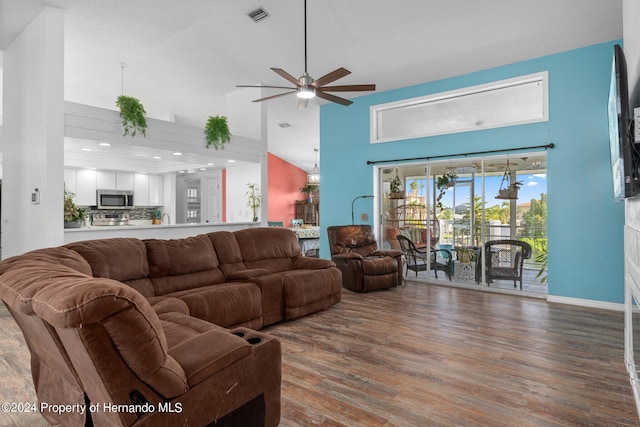 living room featuring ceiling fan, wood-type flooring, and high vaulted ceiling