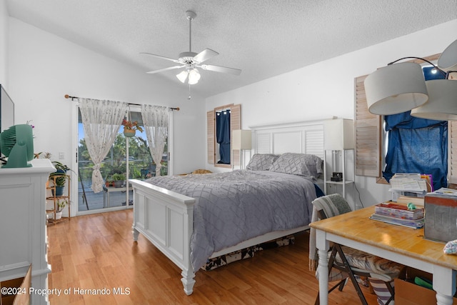 bedroom featuring light wood-type flooring, a textured ceiling, ceiling fan, and access to exterior