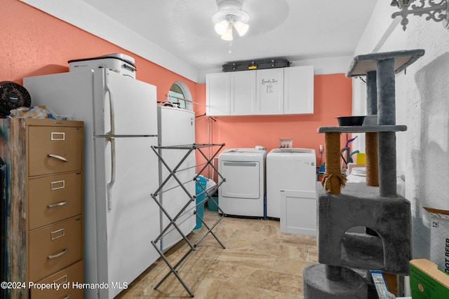 washroom with ceiling fan, cabinets, and separate washer and dryer