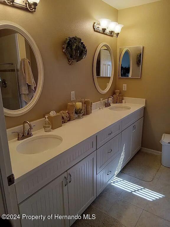 bathroom with vanity and tile patterned flooring