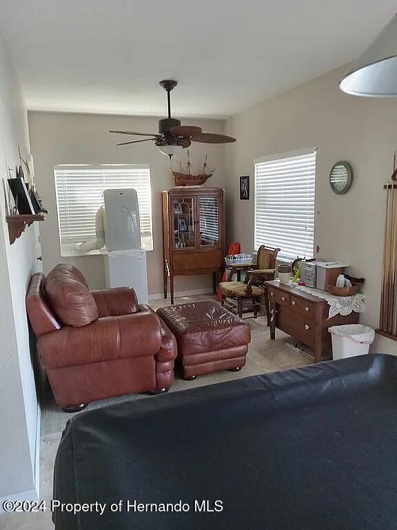 living room featuring ceiling fan