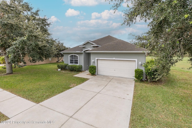 ranch-style home featuring a garage and a front yard