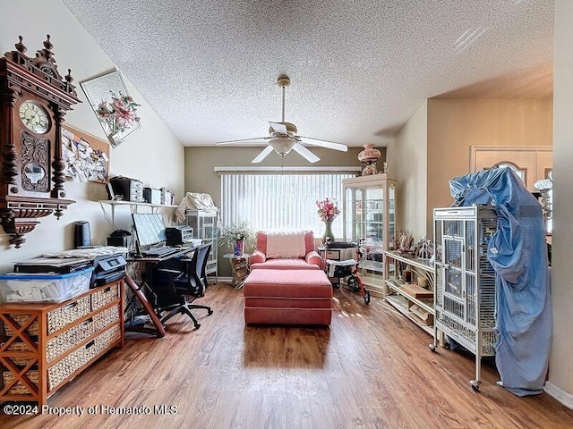 office area featuring a textured ceiling, hardwood / wood-style floors, and ceiling fan