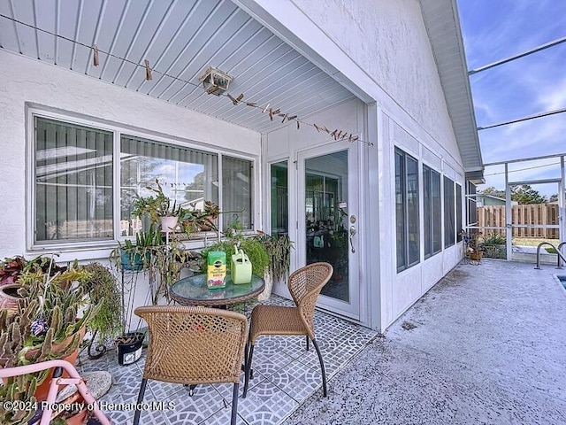 view of patio / terrace with a lanai