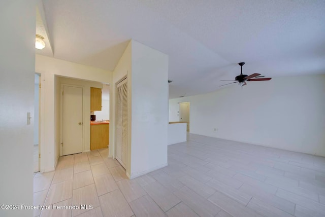 spare room featuring ceiling fan and light hardwood / wood-style flooring