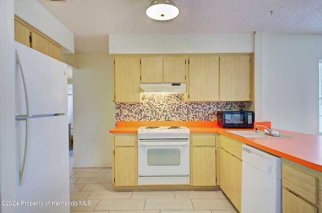 kitchen featuring decorative backsplash, light brown cabinetry, white appliances, and sink